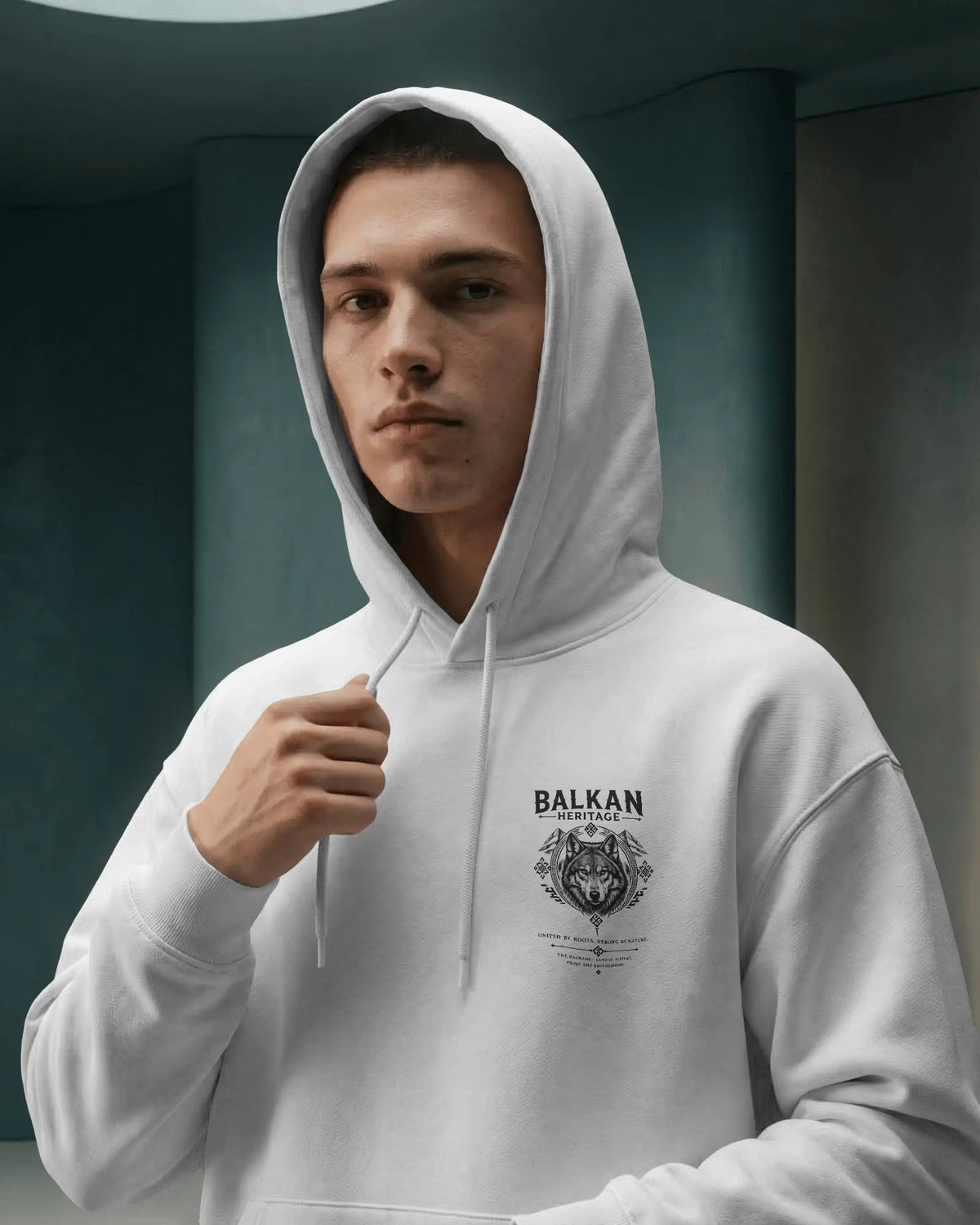 BALKAN HERITAGE Wolf Hoodie am Model mit dezentem Brustprint links